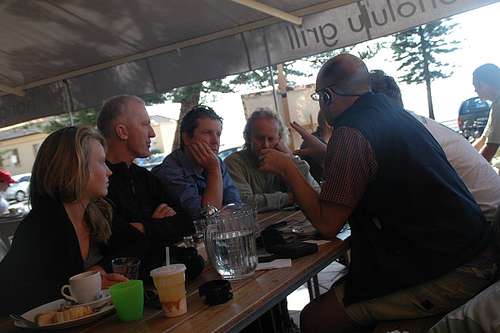 Scholars in discussion over translated texts